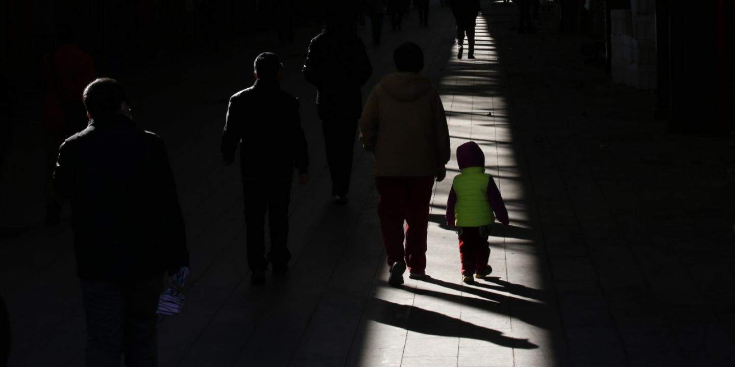 A girl walks with her grandmother at a market in Beijing November 25, 2013.
Photo by KIM KYUNG-HOON/REUTERS. Courtesy of Newsweek. 